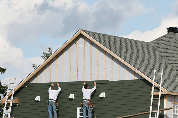 Professional Storm Damage Siding Repair technician working in Fayetteville, PA
